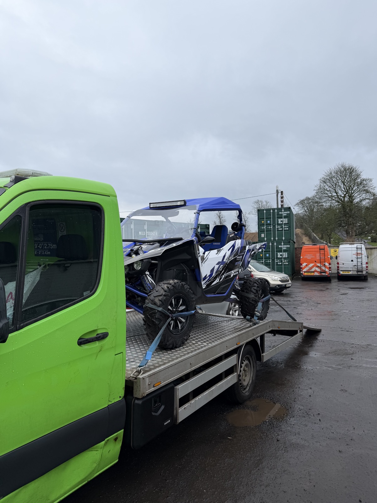 Off-road vehicle strapped on SP Rapid Recovery flatbed truck for vehicle transportation Scotland