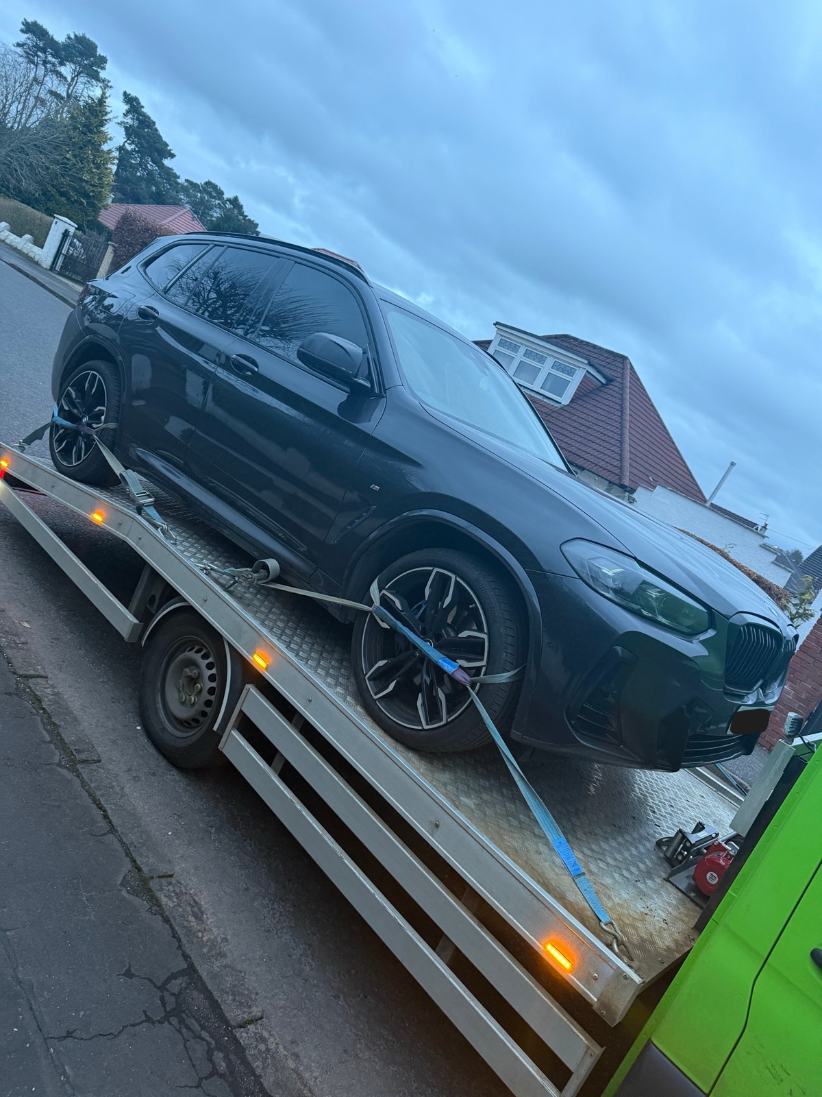 BMW X5 securely strapped on SP Rapid Recovery flatbed for residential vehicle recovery Scotland
