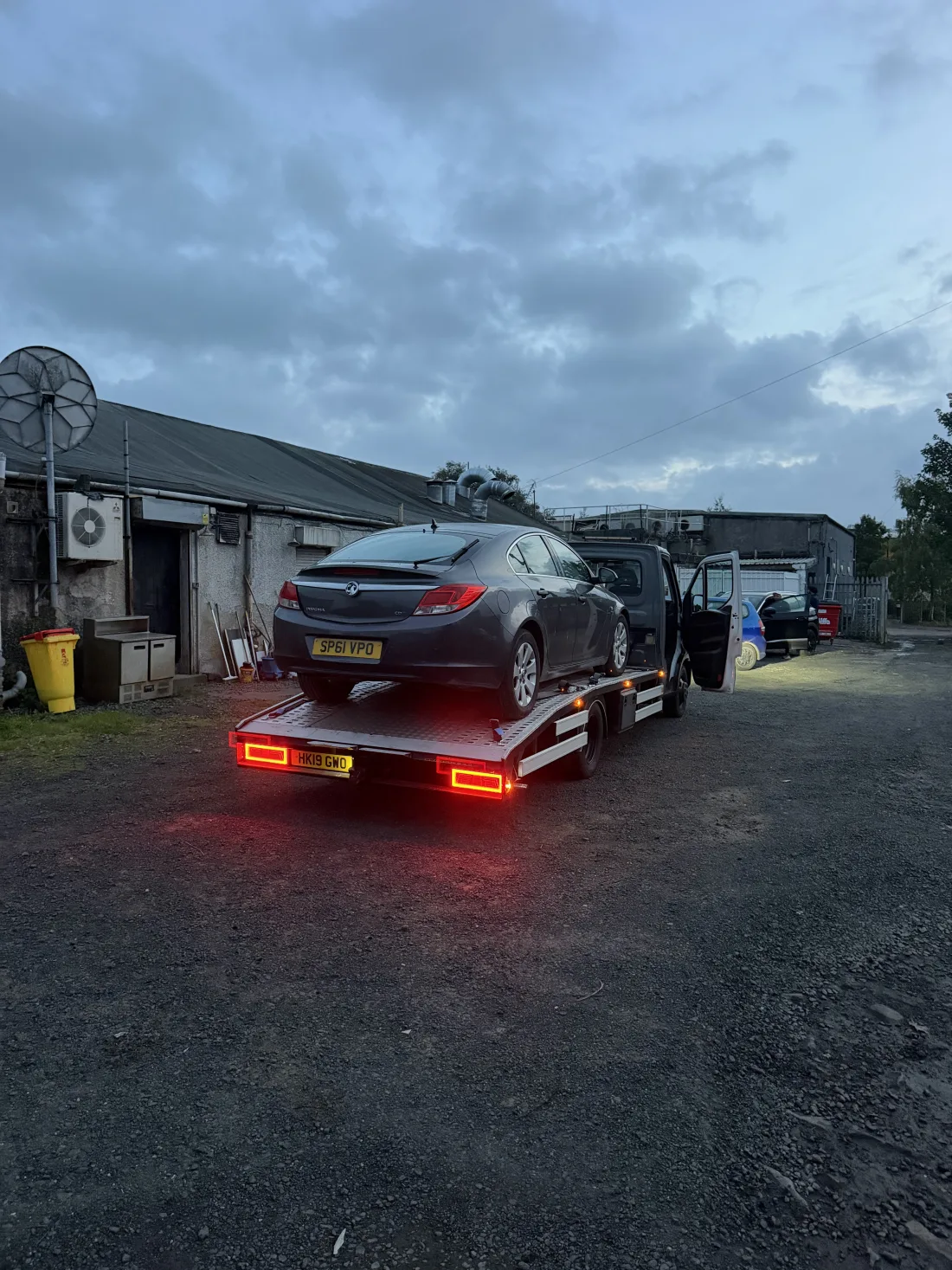SP Rapid Recovery flatbed carrying a car during a vehicle collection